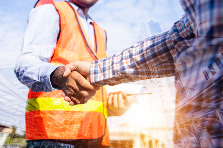 Close-up of a worker measuring materials at a construction site.